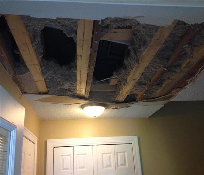 ceiling cut to expose attic